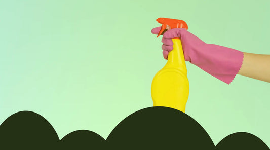 Hand with a cleaning spray